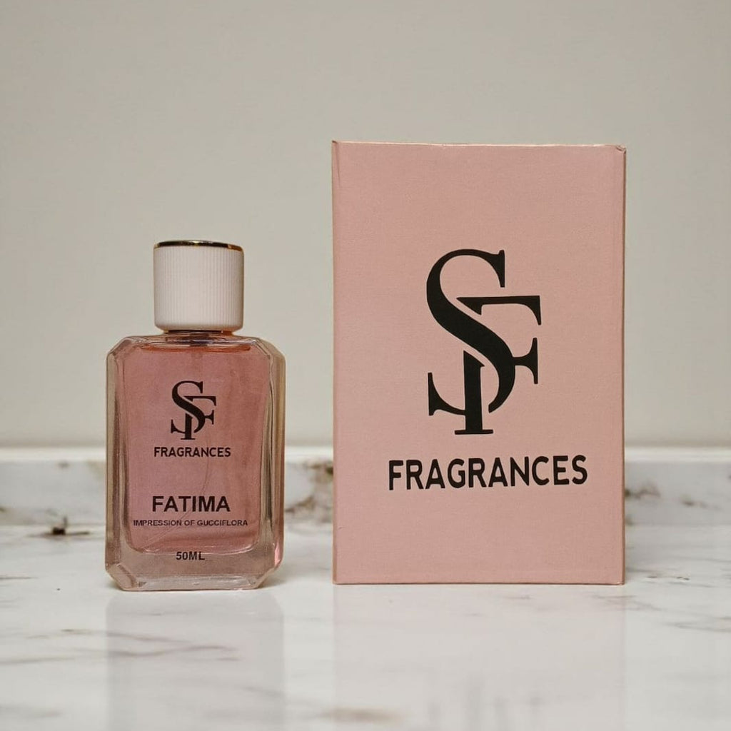 Perfume bottle and packaging with 'SF Fragrances' logo on a marble surface.