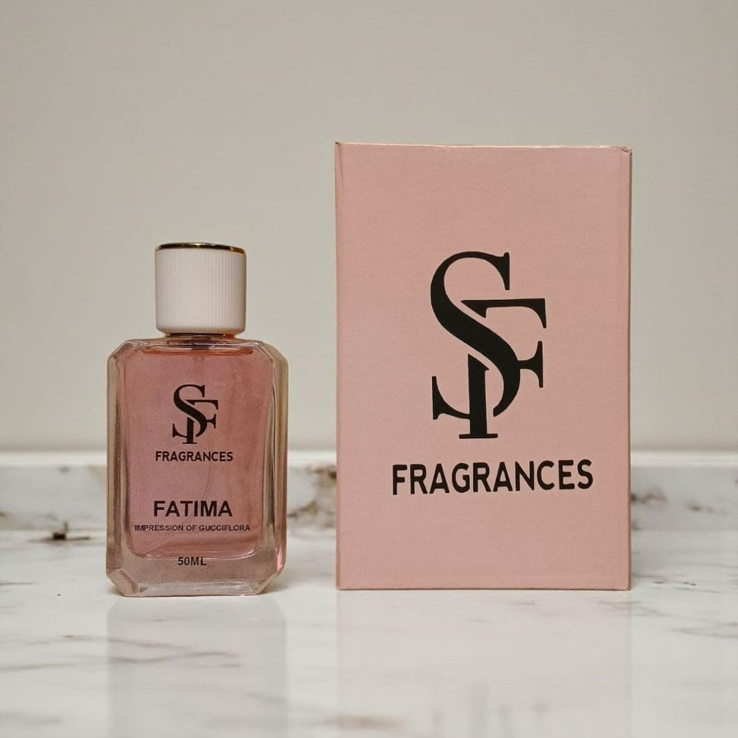 Perfume bottle and packaging with 'SF Fragrances' logo on a marble surface.